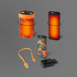 NordicHeat warm clothes with batteries in different designs and colors, as well as charging equipment placed on a grey background.