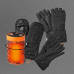 Black gloves and mittens with electric heating function next to an orange storage box, placed on a gray background.